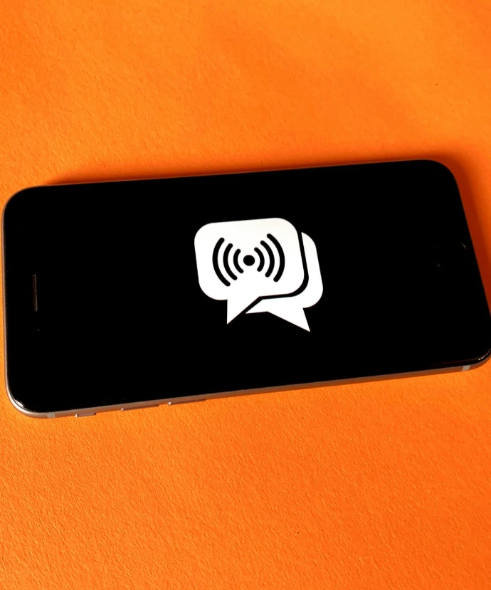 black and white smartphone on brown textile
